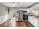 Bright eat-in kitchen with stainless steel appliances and a sliding door to the backyard at 507 Stinson Dr # 3A, Charleston, SC 29407