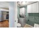 Convenient laundry room with stacked washer and dryer next to kitchen at 507 Stinson Dr # 3A, Charleston, SC 29407