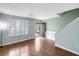 Bright living room with new flooring, fresh paint, and a street view at 507 Stinson Dr # 3A, Charleston, SC 29407