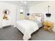 Cozy bedroom features yellow accents, unique light fixtures, neutral tones, and a ceiling fan at 5223 Cottage Landing Dr, Summerville, SC 29485