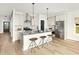 Bright and modern kitchen with stainless steel appliances, a kitchen island, and stylish pendant lighting at 5223 Cottage Landing Dr, Summerville, SC 29485