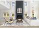 Bright living room with high ceilings, a fireplace, neutral decor, and natural light at 5223 Cottage Landing Dr, Summerville, SC 29485