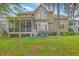Exterior of home from the backyard featuring a screened porch and patio at 5411 Nesting Pl, North Charleston, SC 29420