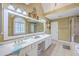 Bright bathroom with double vanity, tiled floor, and a separate shower and soaking tub at 5411 Nesting Pl, North Charleston, SC 29420