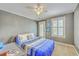 Cozy bedroom featuring modern ceiling fan and wall paint, with lots of natural light at 5411 Nesting Pl, North Charleston, SC 29420