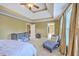 Bedroom featuring a ceiling fan, neutral walls, and lots of natural light from the windows at 5411 Nesting Pl, North Charleston, SC 29420