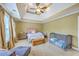 Spacious bedroom featuring a ceiling fan, neutral walls, and lots of natural light from the windows at 5411 Nesting Pl, North Charleston, SC 29420