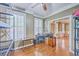 Bedroom with ceiling fan, hardwood flooring, natural lighting, and simple furnishing at 5411 Nesting Pl, North Charleston, SC 29420