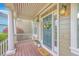 Charming front porch with a welcoming floral wreath and 'hello' doormat at 5411 Nesting Pl, North Charleston, SC 29420