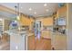 Well-lit kitchen features stainless steel appliances, granite countertops, and wood cabinets at 5411 Nesting Pl, North Charleston, SC 29420