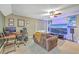 Comfortable Living Room with desk, chair, and large flat screen TV at 5411 Nesting Pl, North Charleston, SC 29420