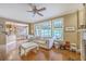 Bright living room with hardwood floors, fireplace, and lots of natural light through large windows at 5411 Nesting Pl, North Charleston, SC 29420