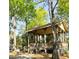 Community pavilion with seating and shelter, surrounded by mature trees at 5411 Nesting Pl, North Charleston, SC 29420