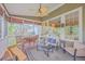 Inviting screened porch with comfortable seating and ample natural light at 5411 Nesting Pl, North Charleston, SC 29420