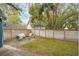Backyard featuring a stone patio with furniture and a spacious grassy area at 6 Beverly Rd, Charleston, SC 29407