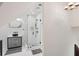 Bright bathroom features a glass shower, black accents, and designer vanity cabinet at 6 Beverly Rd, Charleston, SC 29407