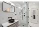 Modern bathroom showcasing glass shower, and stylish vanity with dark fixtures at 6 Beverly Rd, Charleston, SC 29407