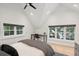 Bright bedroom features a ceiling fan, two windows, and a desk with a chair at 6 Beverly Rd, Charleston, SC 29407
