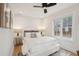 Bright, airy bedroom with neutral tones, wood flooring, and a modern ceiling fan at 6 Beverly Rd, Charleston, SC 29407