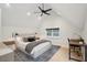 Cozy bedroom with vaulted ceiling, wood floors, and plenty of natural light from a large window at 6 Beverly Rd, Charleston, SC 29407