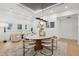 Elegant dining room with stylish table, chairs, modern lighting, and access to additional living spaces at 6 Beverly Rd, Charleston, SC 29407