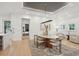 Elegant dining room with stylish table, chairs, modern lighting, and access to additional living spaces at 6 Beverly Rd, Charleston, SC 29407