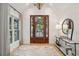Inviting foyer with hardwood floors, stylish console table, contemporary lighting, and decorative mirror at 6 Beverly Rd, Charleston, SC 29407
