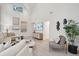 Bright living room featuring vaulted ceiling, comfortable seating, modern decor, and natural light at 6 Beverly Rd, Charleston, SC 29407