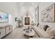 Bright living room featuring vaulted ceiling, comfortable seating, modern decor, and natural light at 6 Beverly Rd, Charleston, SC 29407