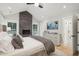 Comfortable main bedroom featuring a fireplace, vaulted ceilings, and modern decor, providing a relaxing retreat at 6 Beverly Rd, Charleston, SC 29407
