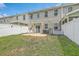 Yard with patio, privacy fence, chairs and grill with small area of sparse grass at 637 Hilchot Dr, Summerville, SC 29486