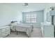 Bedroom featuring a large window, neutral walls, carpet, and large dresser with mirror at 637 Hilchot Dr, Summerville, SC 29486