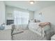 Neutral guest bedroom with platform bed, lots of natural light, and playful decorative touches at 637 Hilchot Dr, Summerville, SC 29486