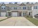 Attractive townhomes with well-maintained lawns and driveways, providing curb appeal and convenient parking at 637 Hilchot Dr, Summerville, SC 29486