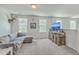Spacious living room features neutral carpet, lots of natural light, and rustic wood entertainment center at 637 Hilchot Dr, Summerville, SC 29486