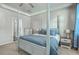 Serene main bedroom with a four-poster bed, soft lighting, and neutral decor at 637 Hilchot Dr, Summerville, SC 29486
