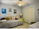 Neutral bedroom featuring a twin bed with cute throw pillows and closet for ample storage at 8530 Bentwood Dr, North Charleston, SC 29406