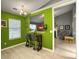 Bright green dining area next to living room and kitchen, featuring modern table and chairs for comfortable dining at 8530 Bentwood Dr, North Charleston, SC 29406