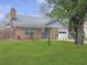 Beautiful single Gathering home with a well-manicured lawn, brick facade, and an attached one-car garage at 8530 Bentwood Dr, North Charleston, SC 29406