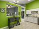 Bright, modern kitchen with white cabinets and stainless steel appliances, next to dining area for easy entertaining at 8530 Bentwood Dr, North Charleston, SC 29406