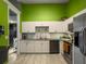 Modern kitchen with white cabinets, stainless steel appliances and a great view to the living spaces with a breakfast bar at 8530 Bentwood Dr, North Charleston, SC 29406