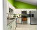 Well-equipped kitchen with stainless steel appliances, gray countertops, and ample white cabinetry at 8530 Bentwood Dr, North Charleston, SC 29406
