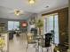 Bright living room featuring hardwood floors, a ceiling fan, and sliding glass doors leading to the outside at 8530 Bentwood Dr, North Charleston, SC 29406