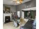 Open-concept living room with fireplace, vaulted ceilings, and seamless flow into dining area, enhanced by natural light at 8530 Bentwood Dr, North Charleston, SC 29406