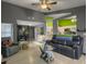 Spacious living room featuring a large sectional, vaulted ceilings, and unique decor creating an inviting space at 8530 Bentwood Dr, North Charleston, SC 29406
