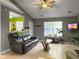Inviting living room with comfortable seating, vaulted ceilings and ample natural light, creating a cozy atmosphere at 8530 Bentwood Dr, North Charleston, SC 29406