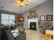 Comfortable living room with a cozy fireplace, lots of natural light, and stylish furnishings for relaxation and entertainment at 8530 Bentwood Dr, North Charleston, SC 29406
