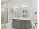 Bathroom with double sinks, gray cabinets, a glass shower and soaking tub at 861 Recess Point Dr, Moncks Corner, SC 29461