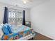 Bedroom with natural light and brightly colored comforter at 861 Recess Point Dr, Moncks Corner, SC 29461