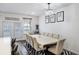 Elegant dining area featuring a large table, modern chandelier, and stylish decor at 861 Recess Point Dr, Moncks Corner, SC 29461